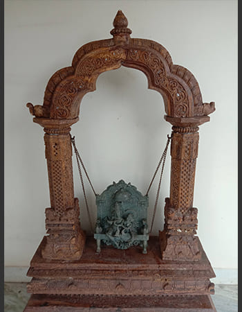 Hotel garden stone sculpture installation creating serene architectural focal point