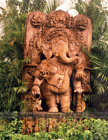 Institutional building stone carving displaying traditional motifs and contemporary design