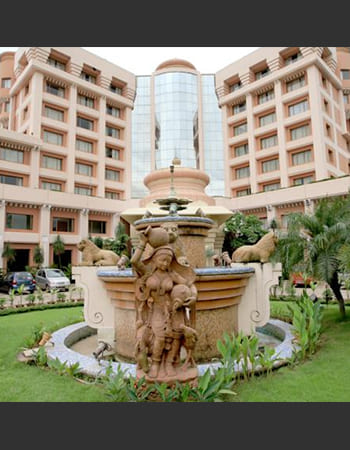 Institutional building stone carving displaying traditional motifs and contemporary design