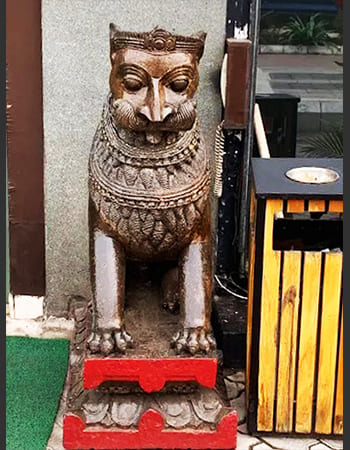 Elegant stone sculpture installation at luxury hotel entrance showcasing traditional craftsmanship