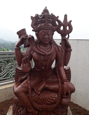 Corporate entrance stone sculpture featuring symbolic elements representing unity and strength