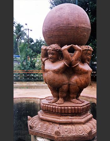 Hotel garden stone sculpture installation creating serene architectural focal point