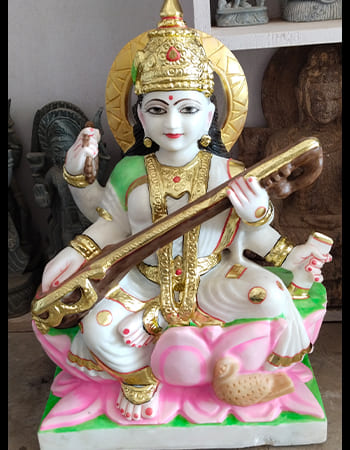 Intricate marble wall relief depicting temple architecture with fine detailed carving work and spiritual motifs