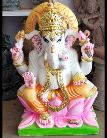 Powerful pink marble Durga sculpture with multiple arms and detailed weapon carvings in traditional Odia style